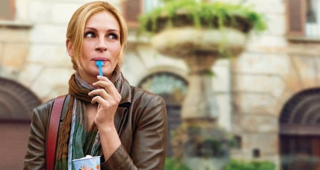 Liz walking through Rome with a gelato — one of the final Italy scenes